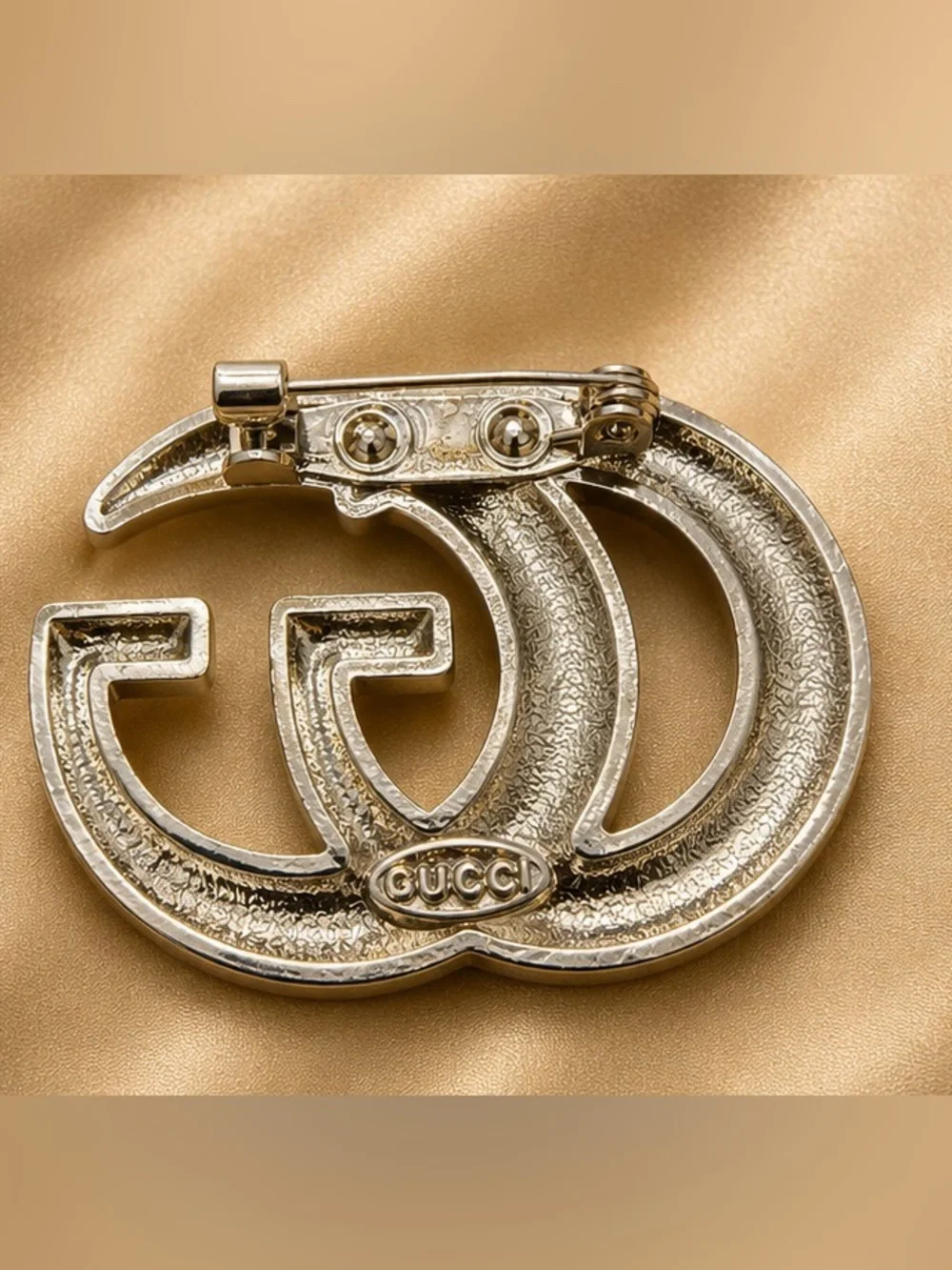Gold Tone Rhinestone Interlocking Letter Statement Brooch Pin